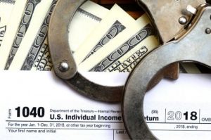 Mercedes Tax Fraud Defense Attorney criminal tax segment block 300x199